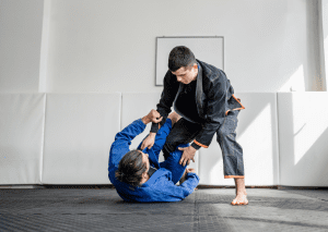 BJJ practitioners demonstrate guard pass defense, showcasing the importance of positional control in Brazilian Jiu-Jitsu.