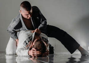 BJJ practitioners maintain top control with an aggressive posture, emphasizing dominance and technique during training.