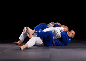 Two BJJ practitioners engaged in a back mount position, showcasing control and submission techniques in Brazilian Jiu-Jitsu.